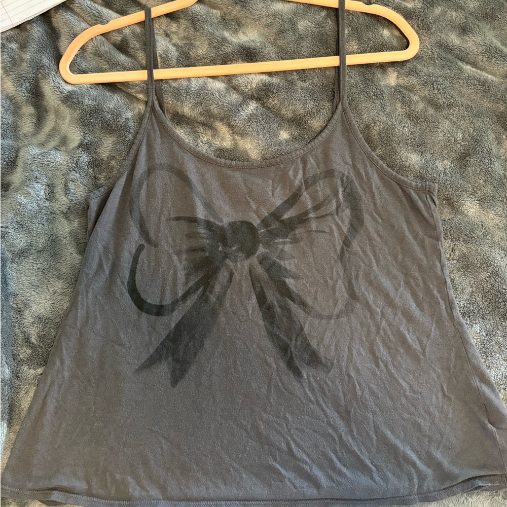 Forever 21 spaghetti strap with cute bow on front. Low back